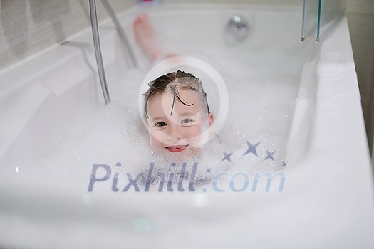 little girl playing with soap foam in bath during coronavirus stay at home pandemic quarantine little girl playing with soap foam in bath during coronavirus stay at home pandemic quarantine