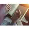 muslim man praying Allah alone inside the mosque and reading islamic holly book quran