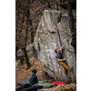 Rock climbers climbing on a boulder rock outdoors