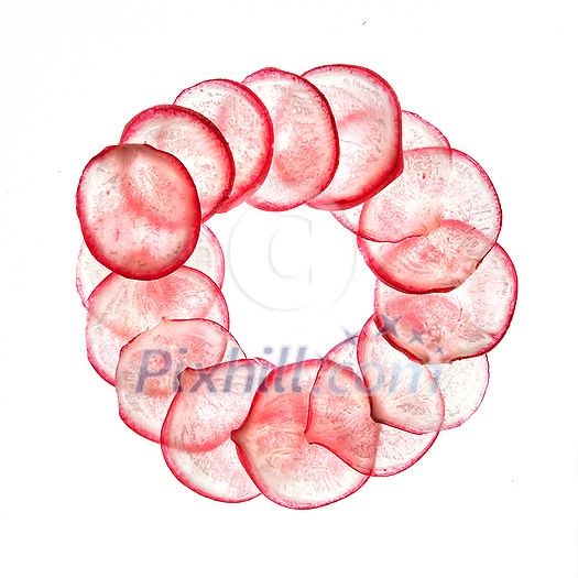 Creative vegetable round frame from transparent slices of fresh home grown and chopped natural organic radish against white background with copy space. Vegan healthy food concept. Creative vegetable round frame from transparent slices of fresh home grown and chopped natural organic radish against white background with copy space. Vegan healthy food concept.
