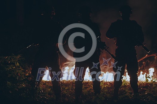 special marines military forces squad soldiers group portrait after finished mission complete fire in background special marines military forces squad soldiers group portrait after finished mission complete fire in background