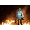 firefighter portrait on authentic fire location in forest