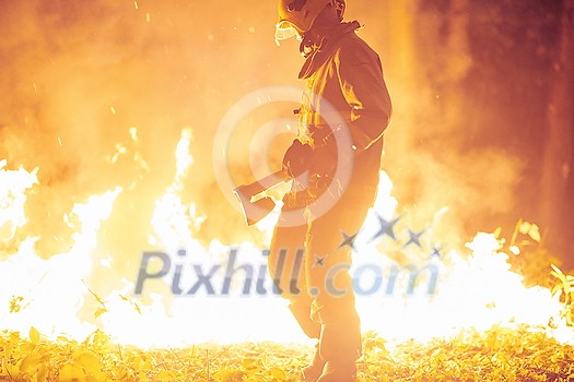 firefighter portrait on authentic fire location in forest firefighter portrait on authentic fire location in forest