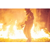 firefighter portrait on authentic fire location in forest