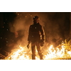 firefighter portrait on authentic fire location in forest