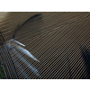 Intense agriculture fiekd being irrigatedwith huge amounts of water on a hot summer day - aerial image