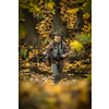 Handsome fisherman holding a lovely trout while  fly fishing on a splendid mountain river