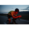 triathlon athlete riding professional racing bike at night workout on curvy country road w