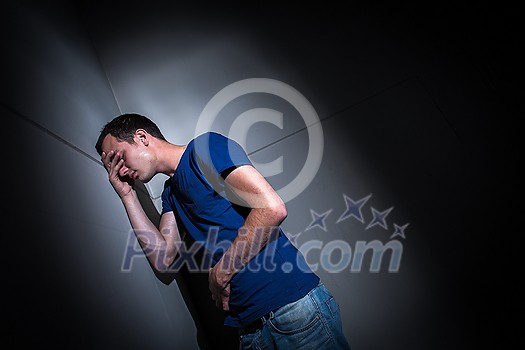 Young man suffering from severe belly pain, being cornered by the debilitating condition of celiak disease/Crohn's disease/autoimune disease Young man suffering from severe belly pain, being cornered by the debilitating condition of celiak disease/Crohn's disease/autoimune disease