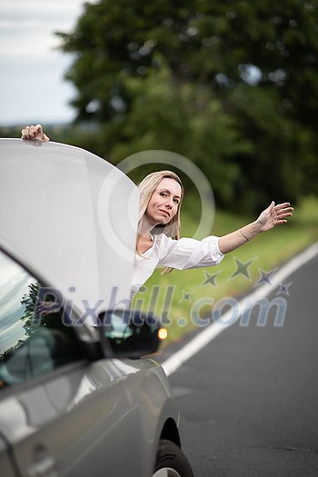 Pretty middle aged woman having car troubles - broken down car on the side of the road, calling the insurance company for assistance Pretty middle aged woman having car troubles - broken down car on the side of the road, calling the insurance company for assistance
