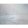 Cross-country skiing: young woman cross-country skiing on a winter day (motion blurred image) - aerial image
