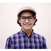 portrait  of smart looking arab teenager with glasses wearing a hat in casual school look isolated on white copy space