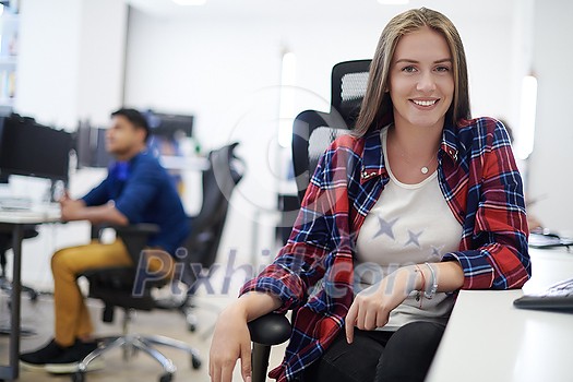 casual business woman working on desktop computer in modern open plan startup office interior casual business woman working on desktop computer in modern open plan startup office interior