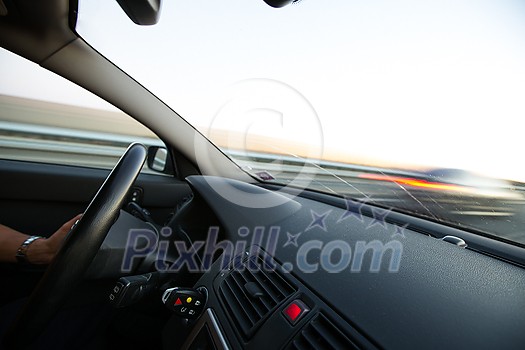 Cars moving fast on a highway (motion blurred image)