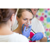 Pretty, young woman being taken care of by medics in a hospital - udergoing a check, getting oxygen