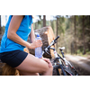 Pretty, young female biker outdoors on her mountain bike (shallow DOF; selective focus)