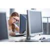 Pretty, female student looking at a desktop computer screen, learning unpleasant news about her exam results. University/office/school concept