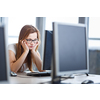Pretty, female student looking at a desktop computer screen, learning unpleasant news about her exam results. University/office/school concept