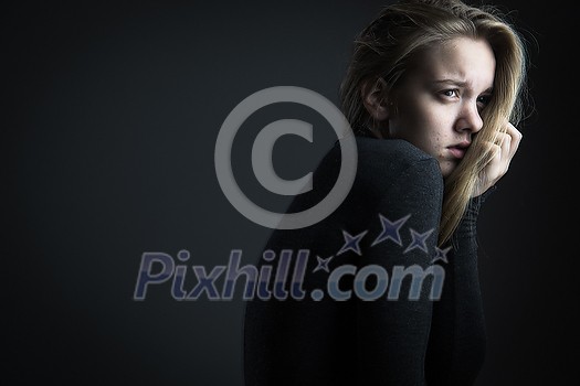 Young woman suffering from a severe depression/anxiety