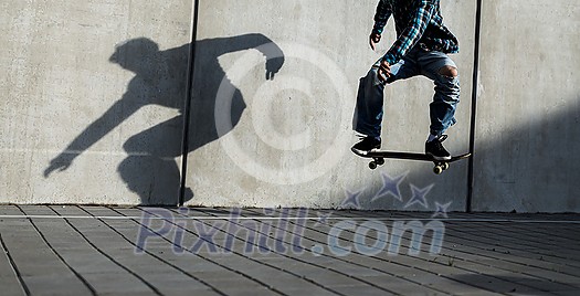Skateboarder riding fast towards the ramps to be lifted into the air and perform a trick