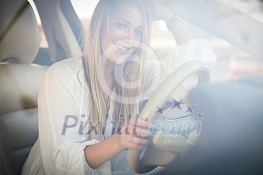 Pretty, young woman  driving a car -Invitation to travel. Car rental or vacation.