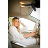 Pretty, young woman  driving a car -Invitation to travel. Car rental or vacation.