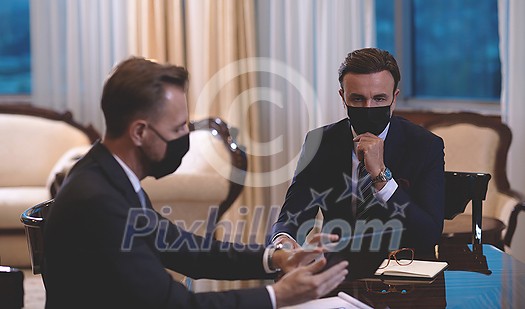 corporate business people team on meeting in luxury office wearing crona virus protection face mask keep social distance corporate business people team on meeting in luxury office wearing crona virus protection face mask keep social distance