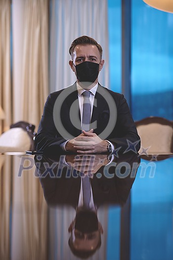 corporate business man wearing protective medical face mask at luxury office corporate business man wearing protective medical face mask at luxury office