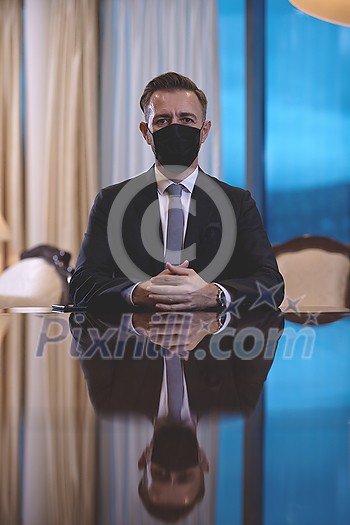 corporate business man wearing protective medical face mask at luxury office