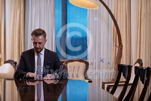 corporate business man using tablet computer in luxury office