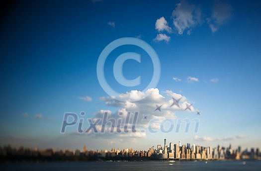 Tilt-shift lens distorted perspective view of New York City NYC Manhattan Downtown Skyline, viewed from Jersey City, New Jersey, USA. Tilt-shift lens distorted perspective view of New York City NYC Manhattan Downtown Skyline, viewed from Jersey City, New Jersey, USA.