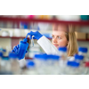 Portrait of a female researcher doing research in a lab (shallow DOF; color toned image)