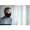 Senior man wearing  a facemask during coronavirus and flu outbreak. Virus and illness protection, home quarantine. COVID-19 concept