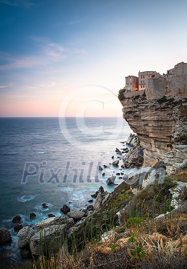 Sunset over the Old Town of Bonifacio, the limestone cliff, South Coast of Corsica Island, France Sunset over the Old Town of Bonifacio, the limestone cliff, South Coast of Corsica Island, France