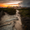 Sunset and storm over the Old Town of Bonifacio, the limestone cliff, South Coast of Corsica Island, France