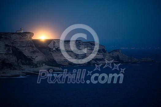 Lighthouse at dusk on the limestone cliff near Bonifacio, South Coast of Corsica Island, France