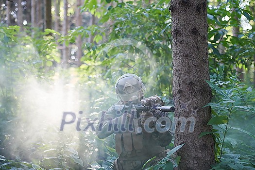 modern warfare soldier in action aiming at weapon laser sight optics in combat position while searching for a target in battle modern warfare soldier in action aiming at weapon laser sight optics in combat position while searching for a target in battle