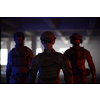 soldier squad team walking  in urban environment  colored neon  lights