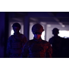 soldier squad team walking  in urban environment  colored neon  lights