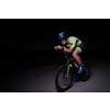 triathlon athlete cycling fast riding professional racing bike at night