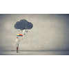 Young businesswoman with colorful umbrella under black cloud