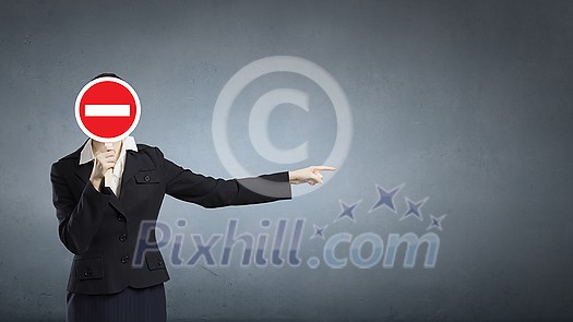 Unrecognizable businesswoman hiding her face behind mask and showing direction Unrecognizable businesswoman hiding her face behind mask and showing direction