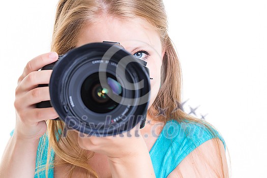 Pretty, female photographer with her digital camera (color toned image; shallow DOF) Pretty, female photographer with her digital camera (color toned image; shallow DOF)