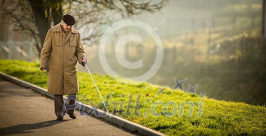 Blind man crossing a street