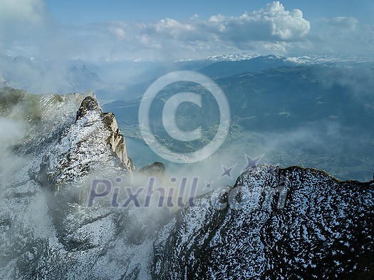 Snowy alpine peaks aerial by Wallensee, Switzerland