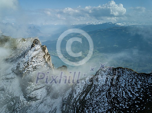 Snowy alpine peaks aerial by Wallensee, Switzerland Snowy alpine peaks aerial by Wallensee, Switzerland