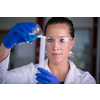 Female researcher carrying out scientific research in a lab (shallow DOF; color toned image)