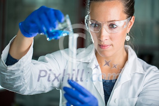 Female researcher carrying out scientific research in a lab (shallow DOF; color toned image) Female researcher carrying out scientific research in a lab (shallow DOF; color toned image)