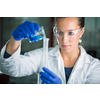 Female researcher carrying out scientific research in a lab (shallow DOF; color toned image)