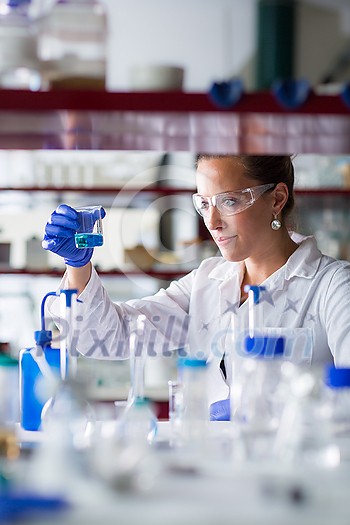 Female researcher carrying out scientific research in a lab (shallow DOF; color toned image) Female researcher carrying out scientific research in a lab (shallow DOF; color toned image)